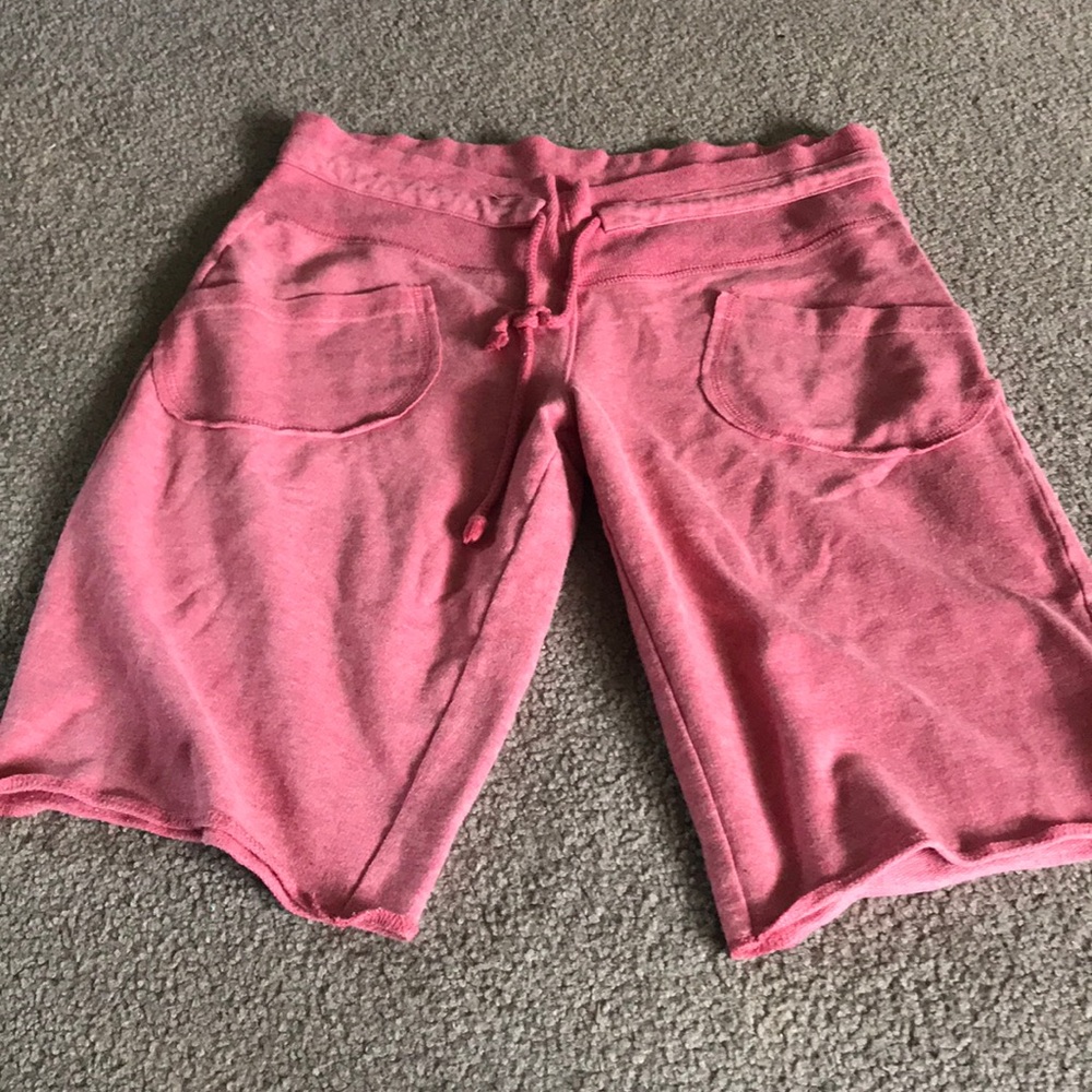 Above the knee, red shorts